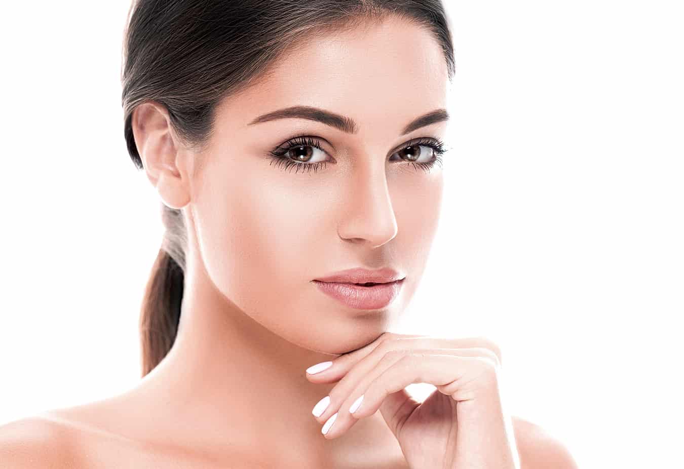 Beautiful woman face close up studio on white